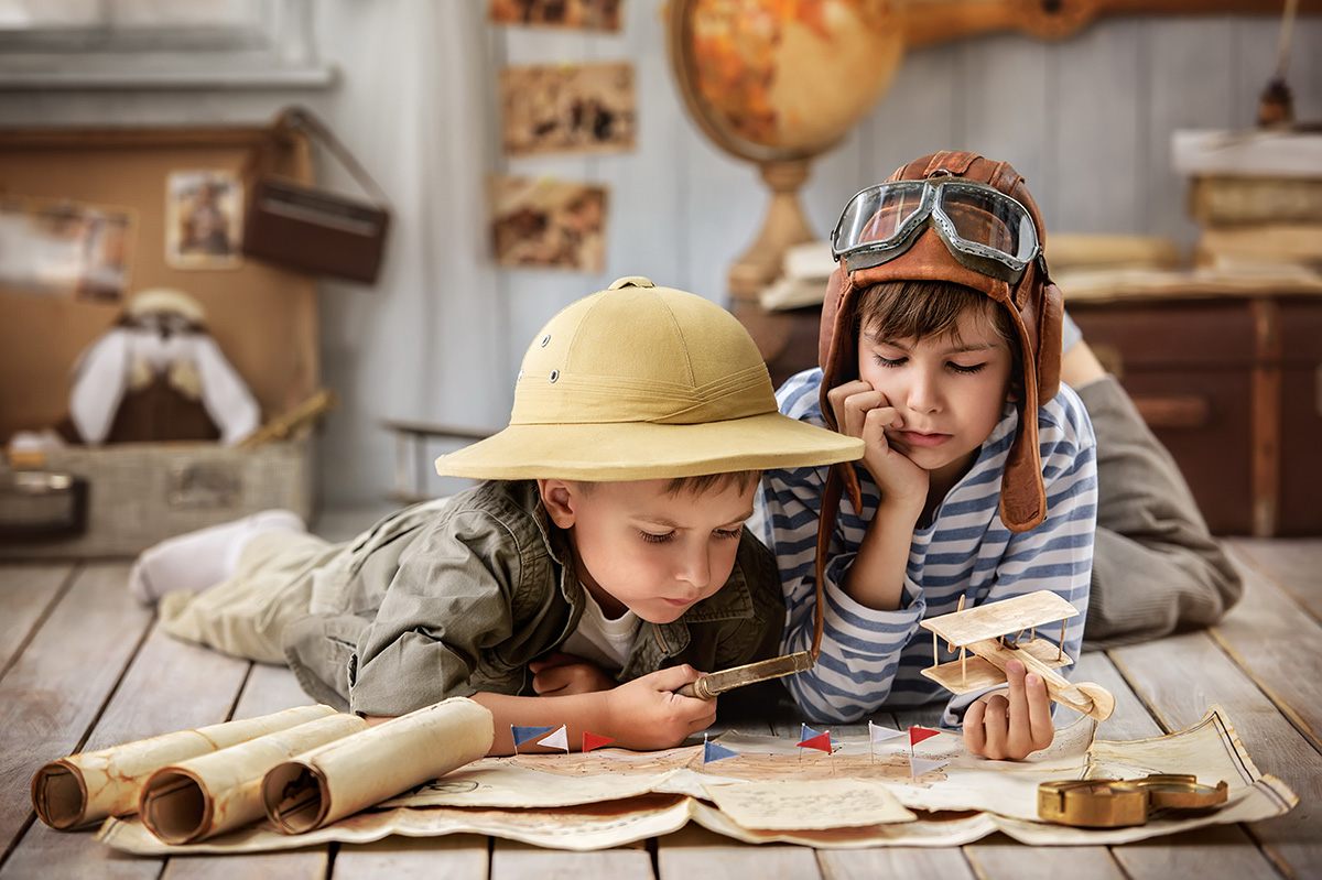 Boys in images traveler and pilot play in his room